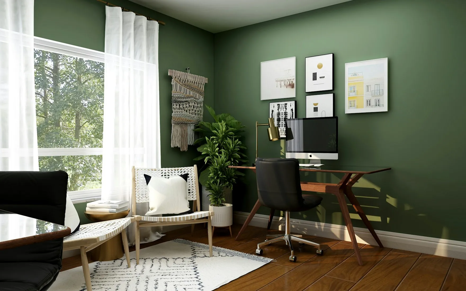 Bureau à domicile avec mur vert profond, bureau en bois et cadres