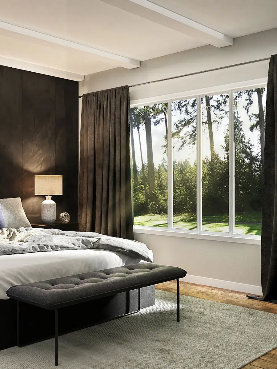 Chambre sombre et feutrée avec tête de lit basse et grande baie